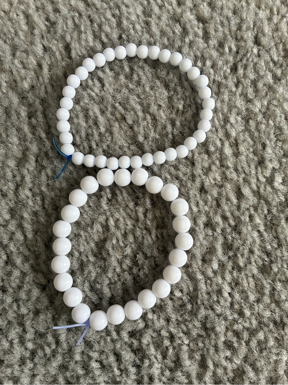 Two white bracelets